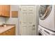 Laundry area features a stacked washer and dryer and storage cabinets at 203 28Th W St, Palmetto, FL 34221