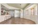 Bright living room features a breakfast bar, luxury vinyl flooring, a ceiling fan, and a dining area at 203 28Th W St, Palmetto, FL 34221