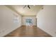 Spacious living room features natural light and hardwood floors, offering a comfortable and inviting atmosphere at 203 28Th W St, Palmetto, FL 34221