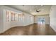 Spacious living room featuring lots of natural light, wood look floors and access to the exterior at 203 28Th W St, Palmetto, FL 34221