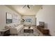 Comfortable living room featuring neutral walls, wood look floors and a ceiling fan at 203 28Th W St, Palmetto, FL 34221