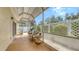 Relaxing screened patio with comfortable seating and a view of the landscaped backyard at 203 28Th W St, Palmetto, FL 34221