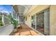 Charming covered patio features comfortable seating and access to the home and private outdoor space at 203 28Th W St, Palmetto, FL 34221