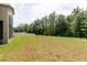 Expansive backyard with lush green grass, partially fenced for privacy at 20316 Natures Corner Dr, Tampa, FL 33647