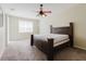 Comfortable carpeted bedroom with ceiling fan and a bright sunny window at 20316 Natures Corner Dr, Tampa, FL 33647