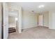 Carpeted bedroom with open doorway and natural light at 20316 Natures Corner Dr, Tampa, FL 33647