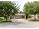 Attractive home with a three-car garage and a well-maintained front yard and landscaping at 20316 Natures Corner Dr, Tampa, FL 33647