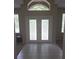 Welcoming front entrance featuring white-tiled floors and a double door at 20316 Natures Corner Dr, Tampa, FL 33647