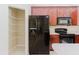 Kitchen featuring stainless steel refrigerator, microwave, range, and abundant cabinet space at 20316 Natures Corner Dr, Tampa, FL 33647
