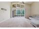 Bright living room features large glass sliding doors, vaulted ceilings, and a ceiling fan at 20316 Natures Corner Dr, Tampa, FL 33647
