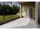 Enjoy the outdoors on the screened-in patio with views of the backyard and greenery at 20316 Natures Corner Dr, Tampa, FL 33647