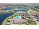 Overhead view showcases community amenities including the pool, clubhouse, and surrounding waterways at 20831 Valprato Ct, Venice, FL 34293
