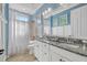 Bright bathroom with a double vanity featuring granite countertops and a shower/tub combination at 20831 Valprato Ct, Venice, FL 34293