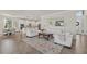Open concept living area featuring neutral tones and access to the kitchen at 20831 Valprato Ct, Venice, FL 34293