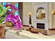Elegant lobby area with a cozy seating area, a fireplace, and stylish décor at 20831 Valprato Ct, Venice, FL 34293
