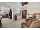 Open loft area featuring comfortable seating, a ceiling fan, and natural light at 20831 Valprato Ct, Venice, FL 34293