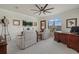 Spacious home office with large window, desk, and comfortable seating at 20831 Valprato Ct, Venice, FL 34293