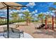 Community playground with swings, slides, and climbing structures, perfect for families at 20831 Valprato Ct, Venice, FL 34293