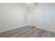 Bright bedroom with wood floor, crown molding, ceiling fan, and a view to the bathroom at 2240 Crystal Lake Trl, Bradenton, FL 34211