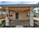 Charming front porch featuring a freshly painted surface, textured walls, and decorative plants enhancing curb appeal at 2411 5Th Avenue E Dr, Palmetto, FL 34221