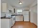 Bright kitchen features white cabinets, tile flooring, and essential appliances at 2411 5Th Avenue E Dr, Palmetto, FL 34221