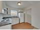 Bright kitchen features white cabinets, tile flooring, and essential appliances at 2411 5Th Avenue E Dr, Palmetto, FL 34221