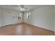 Bright, open living room with tile floors, a ceiling fan, and ample natural light from multiple windows at 2411 5Th Avenue E Dr, Palmetto, FL 34221