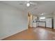 Open-concept living room with tile flooring connecting to the kitchen at 2411 5Th Avenue E Dr, Palmetto, FL 34221