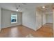 Neutral-toned room with tiled floor, white door, ceiling fan and natural light from the window with blinds at 2411 5Th Avenue E Dr, Palmetto, FL 34221