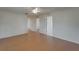 Neutral-toned room with tiled floor, white doors, ceiling fan and open view to other rooms at 2411 5Th Avenue E Dr, Palmetto, FL 34221