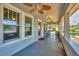 Charming covered front porch with ample seating and natural light, perfect for relaxing at 2529 7Th W Ave, Bradenton, FL 34205