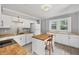 Well-lit kitchen featuring white cabinetry, butcher block counters, and sleek appliances at 2529 7Th W Ave, Bradenton, FL 34205