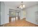 Dining room featuring wood floors with access to the living room at 2606 Bismark Way, Sarasota, FL 34231