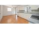 Open kitchen featuring plenty of cabinet space and wood floors at 2606 Bismark Way, Sarasota, FL 34231