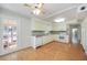 Spacious kitchen featuring white cabinets and wood floors at 2606 Bismark Way, Sarasota, FL 34231