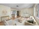 Staged living room offering wood floors and natural light at 2606 Bismark Way, Sarasota, FL 34231