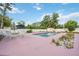 An inviting in-ground pool with a patio and white lounge furniture at 2606 Bismark Way, Sarasota, FL 34231