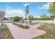 Backyard pool with pink concrete deck and partial view of the privacy fence at 2606 Bismark Way, Sarasota, FL 34231