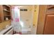 Bright bathroom featuring a shower/tub combination and built-in shelves for storage at 3333 26Th E Ave # 1132, Bradenton, FL 34208