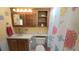 Functional bathroom with a sink, toilet, and vanity with a colorful shower curtain at 3333 26Th E Ave # 1132, Bradenton, FL 34208