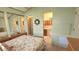 Inviting bedroom with a floral bedspread, mirrored closet doors, and an en-suite bathroom at 3333 26Th E Ave # 1132, Bradenton, FL 34208