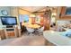 Cozy dining area with a wooden table, comfortable chairs, and built-in display cabinets at 3333 26Th E Ave # 1132, Bradenton, FL 34208