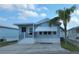 Charming light blue single-story home with well-maintained yard and white trim at 3333 26Th E Ave # 1132, Bradenton, FL 34208