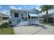 Charming light blue single-story home with well-maintained yard and white trim at 3333 26Th E Ave # 1132, Bradenton, FL 34208