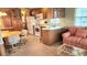 Well-equipped kitchen with white appliances, wood cabinets, and adjacent dining area at 3333 26Th E Ave # 1132, Bradenton, FL 34208
