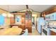 Charming kitchen with wood cabinets, white appliances and an inviting dining area at 3333 26Th E Ave # 1132, Bradenton, FL 34208