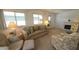 Inviting living room with ample natural light, soft neutral tones and comfortable seating at 3333 26Th E Ave # 1132, Bradenton, FL 34208