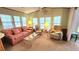 Relaxing living room featuring large windows, comfortable seating, and stylish decor at 3333 26Th E Ave # 1132, Bradenton, FL 34208