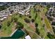 Aerial showing residences surrounding a well-maintained golf course with mature trees and serene lakes at 4102 Lakewood Ave, Bradenton, FL 34208