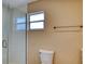 Bathroom with a glass shower and toilet at 4102 Lakewood Ave, Bradenton, FL 34208